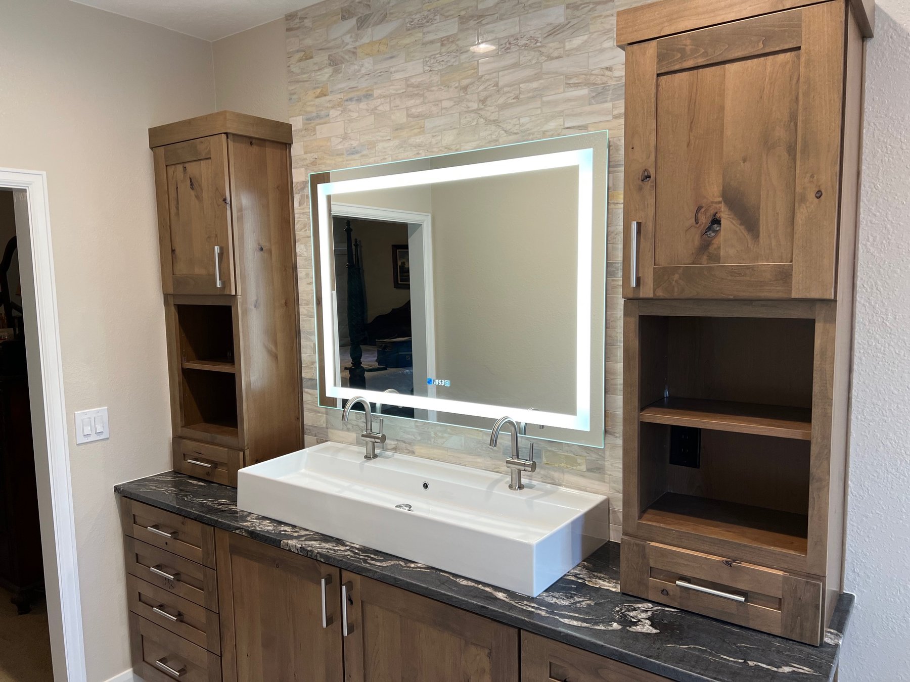 Rustic wood vanity in a remodeled bathroom
