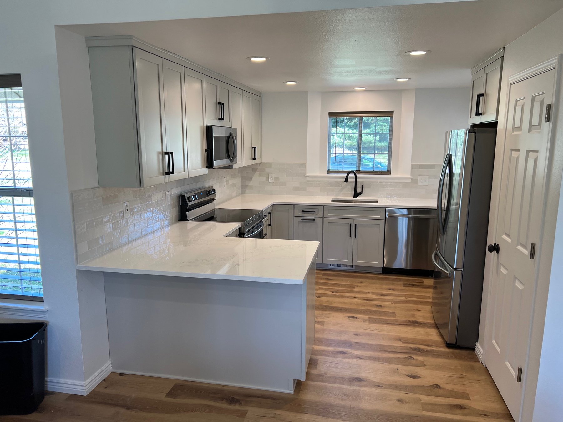 White shaker kitchen with marble countertops
