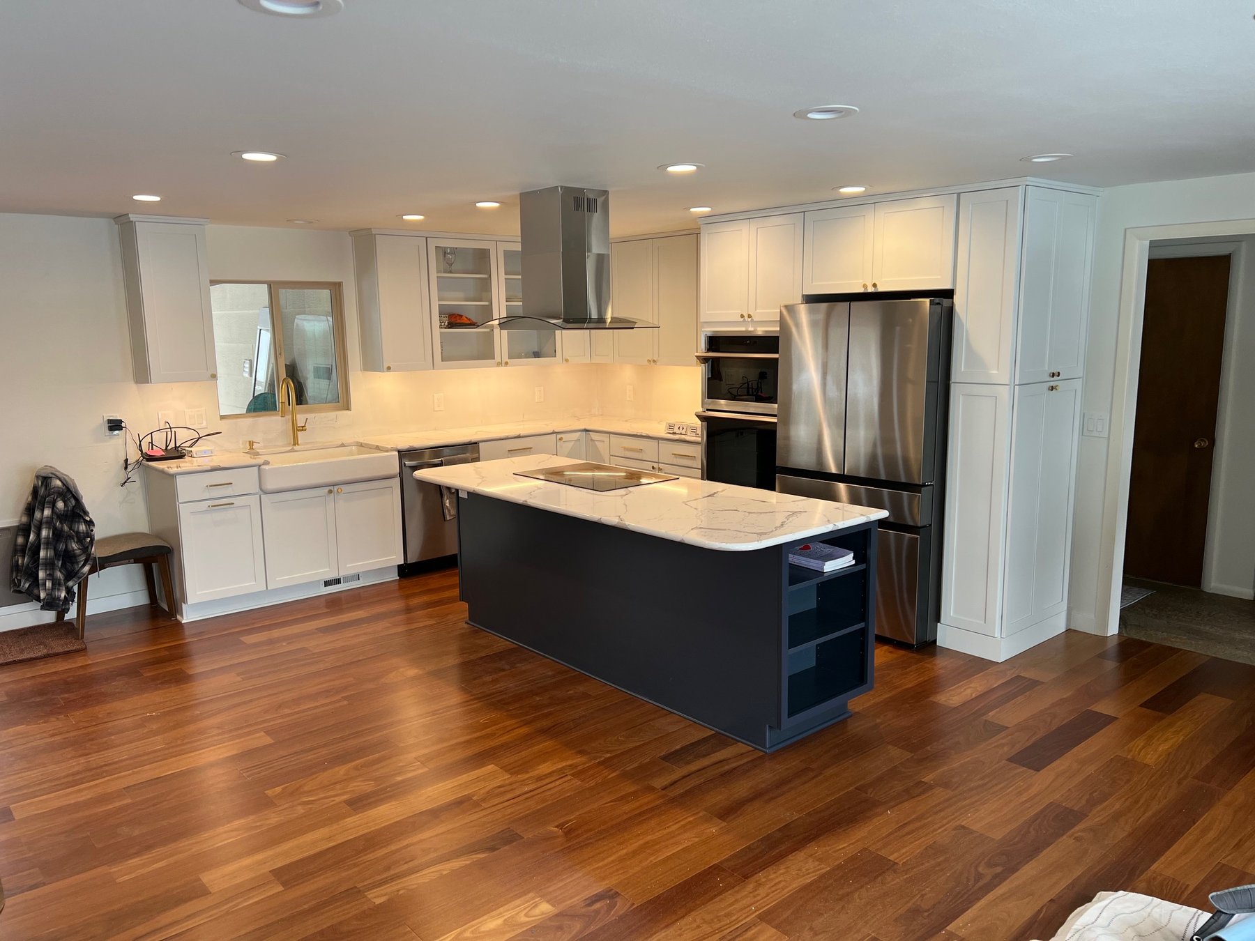 White kitchen with a contrasting dark stained island